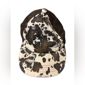 C.C. Distressed Cow Print Criss Cross Trucker Hat | Adjustable Ponytail Cap